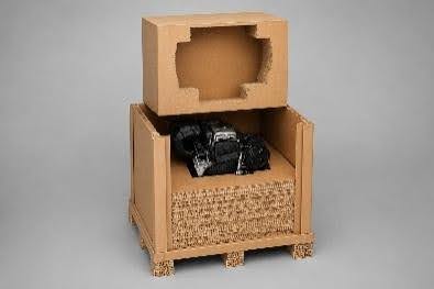 Custom fibre-based industrial packaging protecting automotive components and heavy machinery during transport and export.